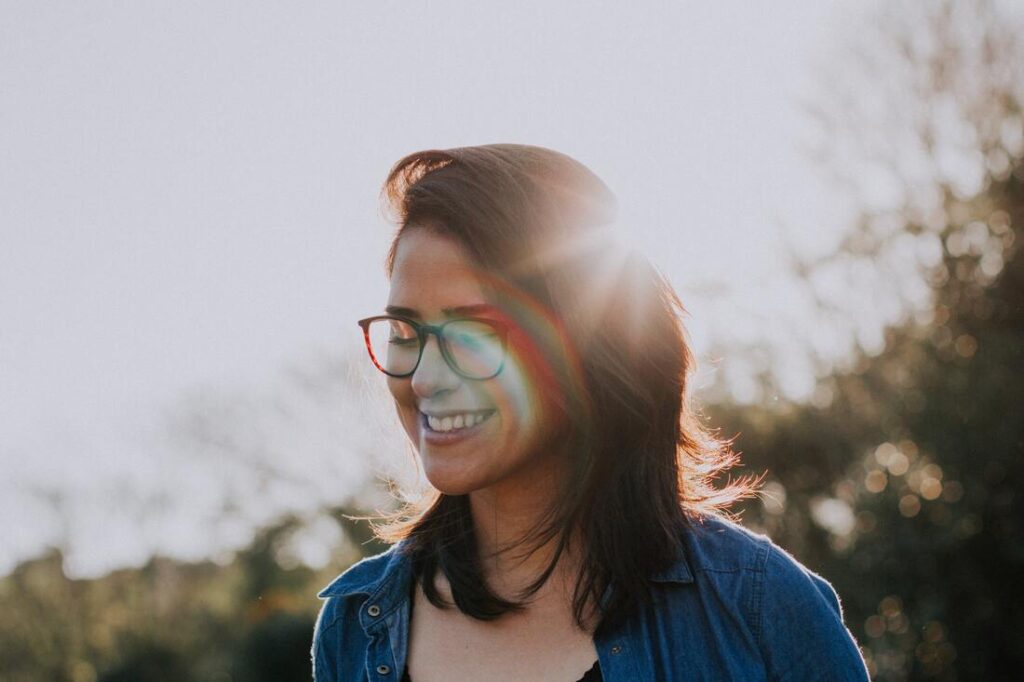 Woman smiles because she received chiropractic care for anxiety.