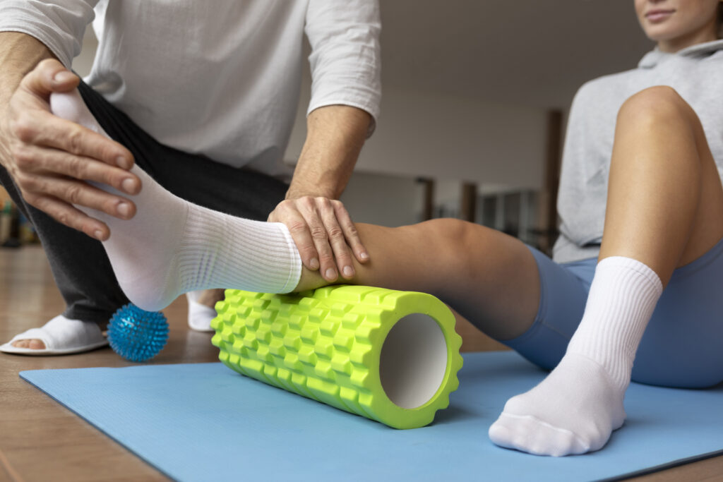 patient doing physical rehabilitation helped by therapists scaled